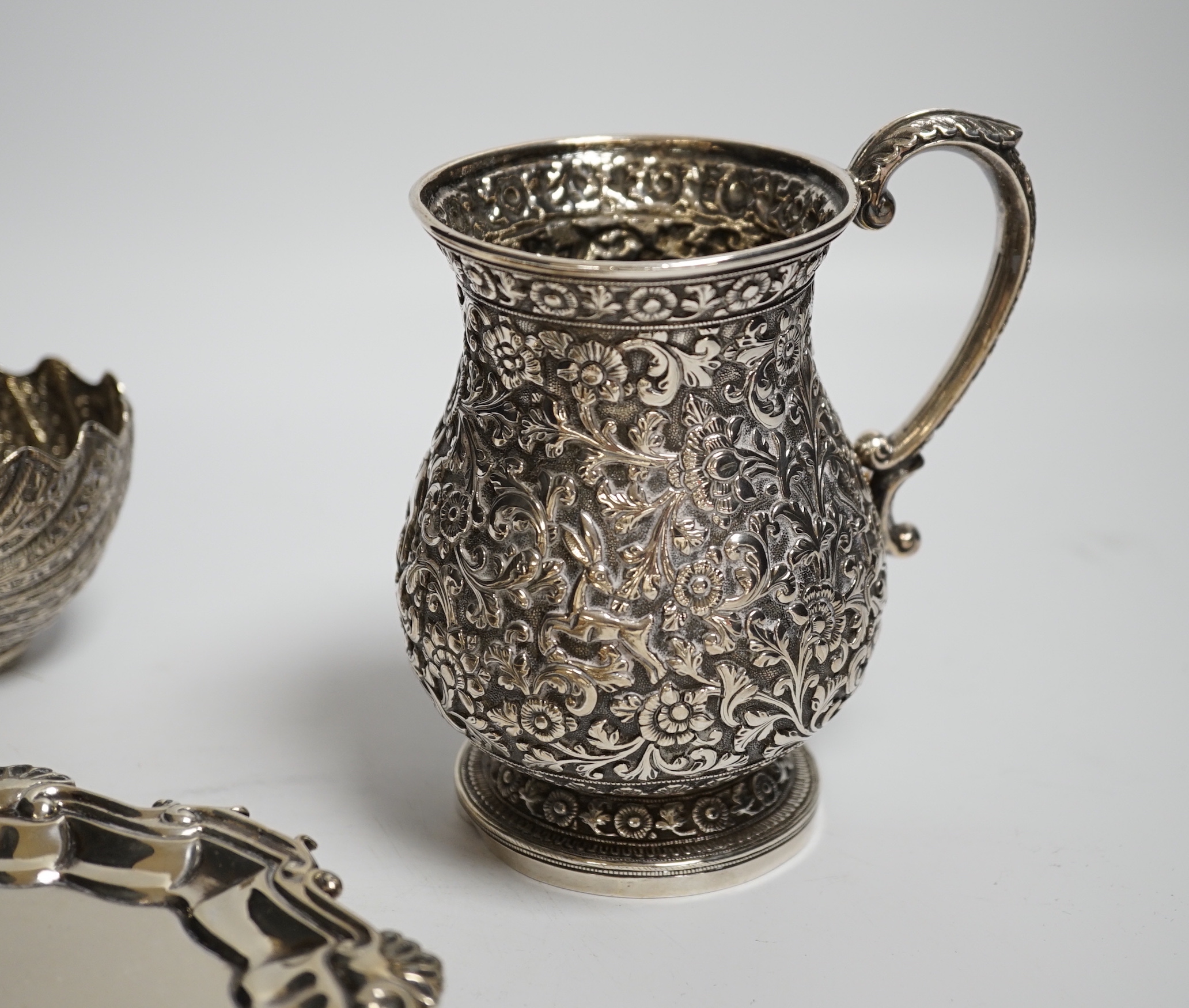 A George II silver waiter, Henry Morris, London, 1747, 17.6cm, together with an Indian? white metal baluster mug and a white metal small bowl.